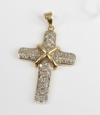 Lot 2689 - A yellow metal diamond cross pendant, having...