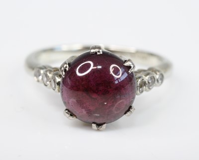 Lot 2613 - A white metal, ruby and diamond dress ring,...