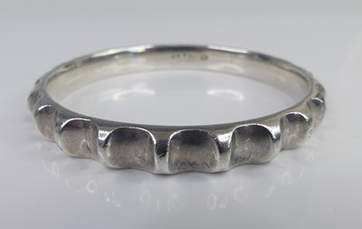 Lot 2763 - Georg Jensen - a sterling silver bangle,...