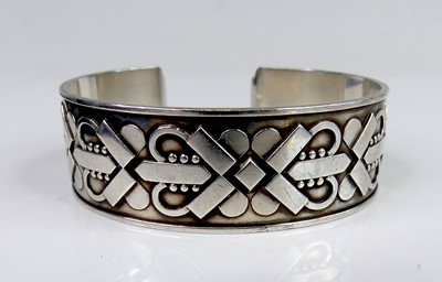Lot 2771 - After Georg Jensen - a white metal cuff bangle...
