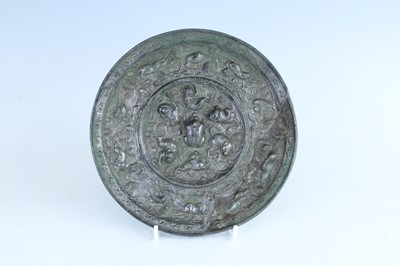 Lot 68 - A Chinese bronze ‘sea creatures and grapevine’...