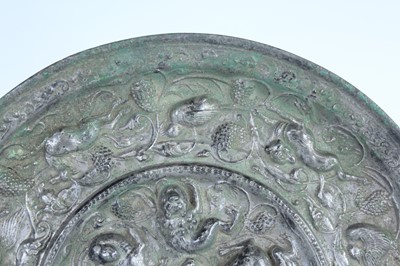 Lot 68 - A Chinese bronze ‘sea creatures and grapevine’...