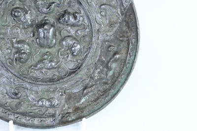 Lot 68 - A Chinese bronze ‘sea creatures and grapevine’...