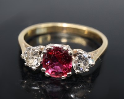 Lot 2579 - A yellow metal ruby and diamond three-stone...