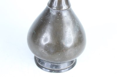 Lot 61 - Three Oriental metal items, 19th–20th century...