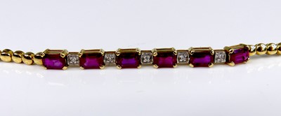 Lot 2570 - A yellow metal ruby and diamond line bracelet,...