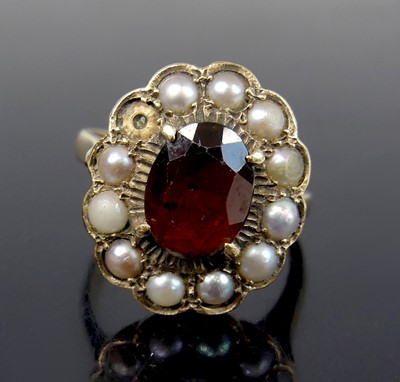 Lot 2580 - A 9ct yellow gold, garnet and pearl oval...