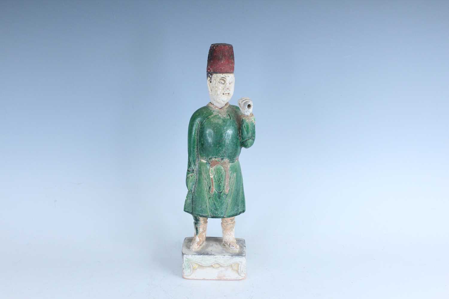 Lot 127 - A Chinese sancai-glazed pottery figure of a...