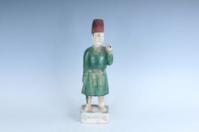 Lot 127 - A Chinese sancai-glazed pottery figure of a...