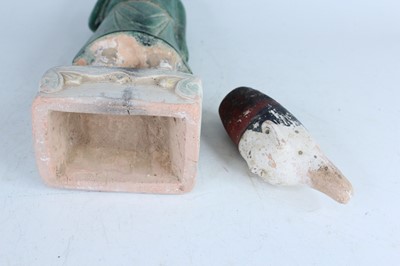 Lot 127 - A Chinese sancai-glazed pottery figure of a...
