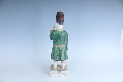 Lot 127 - A Chinese sancai-glazed pottery figure of a...