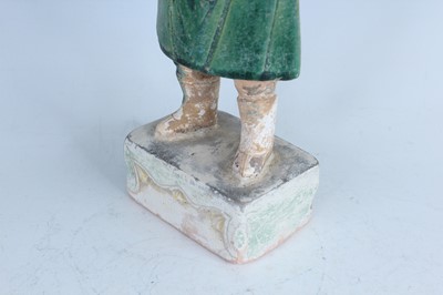 Lot 127 - A Chinese sancai-glazed pottery figure of a...