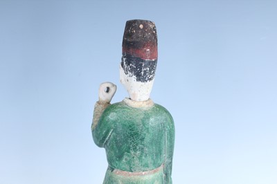 Lot 127 - A Chinese sancai-glazed pottery figure of a...