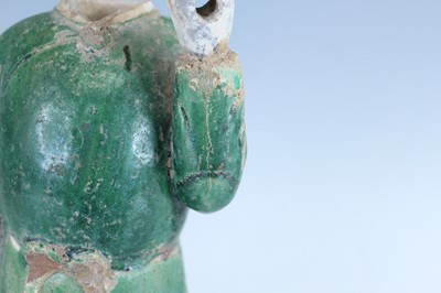 Lot 127 - A Chinese sancai-glazed pottery figure of a...
