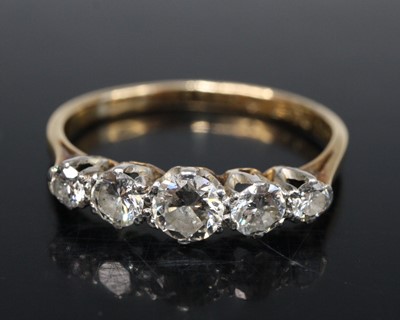 Lot 2581 - A yellow metal diamond half-hoop ring, having...
