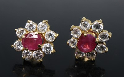 Lot 2584 - A pair of yellow metal, ruby and colourless...