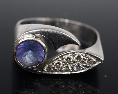 Lot 2585 - A white metal, tanzanite and diamond abstract...