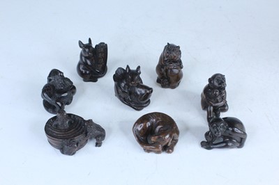 Lot 247 - Eight Japanese wood netsuke, Meiji period A...