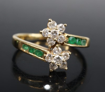 Lot 347 - A yellow metal emerald and diamond double...