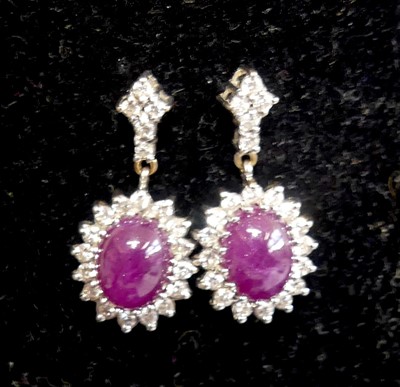 Lot 2596 - A pair of 18ct yellow and white gold, ruby and...