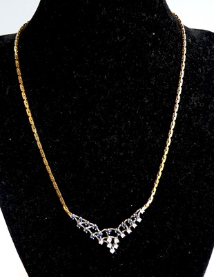 Lot 2597 - An 18ct yellow and white gold sapphire and...