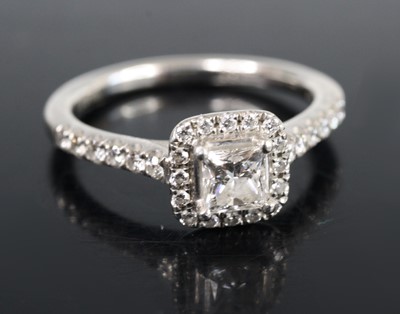 Lot 2728 - A platinum and diamond cluster ring, arranged...