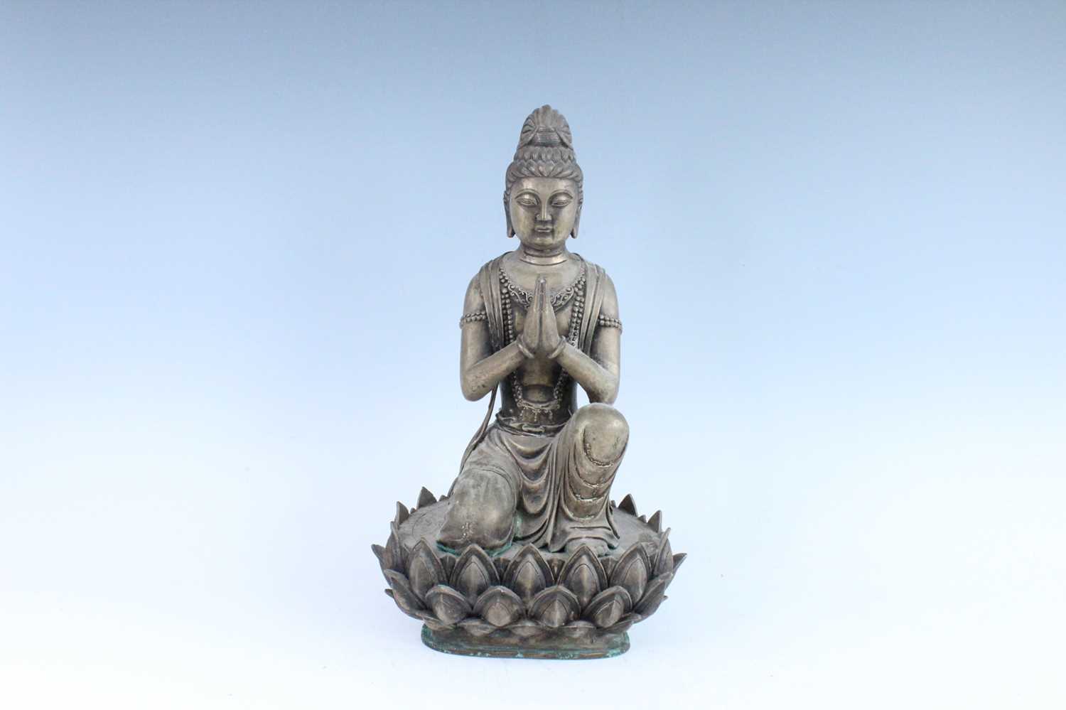 Lot 64 - A large Chinese bronze figure of Buddha on a...