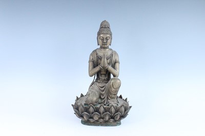 Lot 64 - A large Chinese bronze figure of Buddha on a...