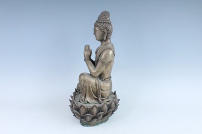 Lot 64 - A large Chinese bronze figure of Buddha on a...