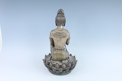 Lot 64 - A large Chinese bronze figure of Buddha on a...