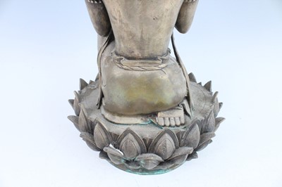 Lot 64 - A large Chinese bronze figure of Buddha on a...