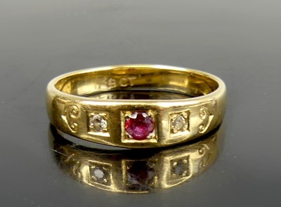 Lot 2602 - A yellow metal, ruby and diamond three-stone...