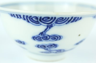 Lot 7 - A small Chinese blue and white ‘swirling...