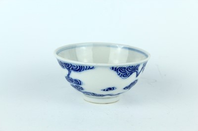 Lot 7 - A small Chinese blue and white ‘swirling...