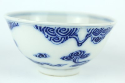 Lot 7 - A small Chinese blue and white ‘swirling...