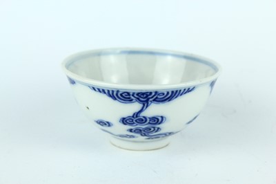 Lot 7 - A small Chinese blue and white ‘swirling...