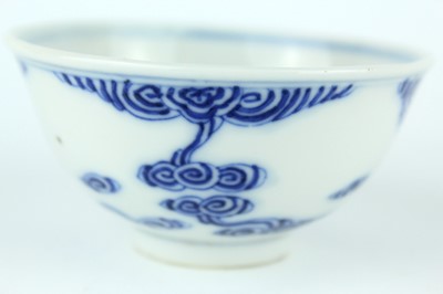 Lot 7 - A small Chinese blue and white ‘swirling...