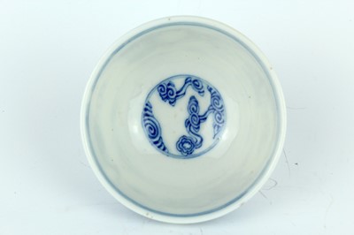 Lot 7 - A small Chinese blue and white ‘swirling...