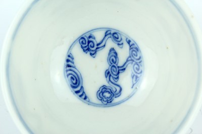 Lot 7 - A small Chinese blue and white ‘swirling...