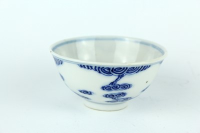 Lot 7 - A small Chinese blue and white ‘swirling...