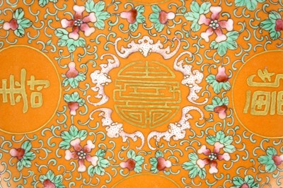 Lot 177 - A Chinese coral-ground famille rose ‘wan shou...