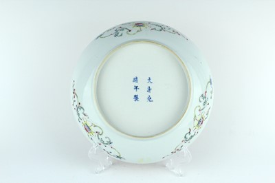 Lot 177 - A Chinese coral-ground famille rose ‘wan shou...