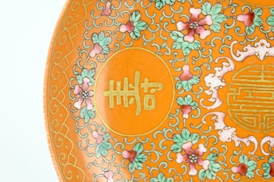 Lot 177 - A Chinese coral-ground famille rose ‘wan shou...
