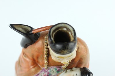 Lot 132 - A Chinese famille rose erotic teapot, late...