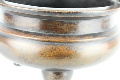 Lot 71 - A large Chinese bronze censer with two handles,...