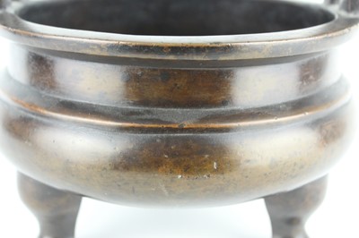 Lot 71 - A large Chinese bronze censer with two handles,...