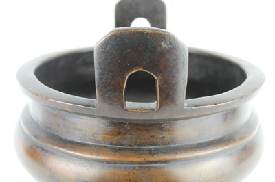 Lot 71 - A large Chinese bronze censer with two handles,...
