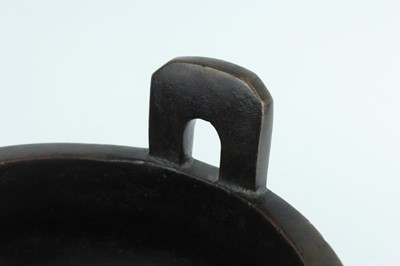 Lot 71 - A large Chinese bronze censer with two handles,...