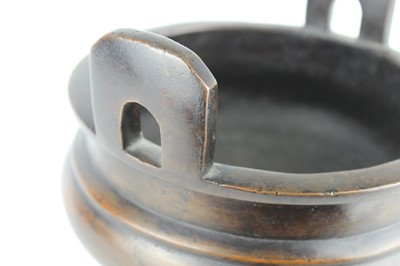 Lot 71 - A large Chinese bronze censer with two handles,...
