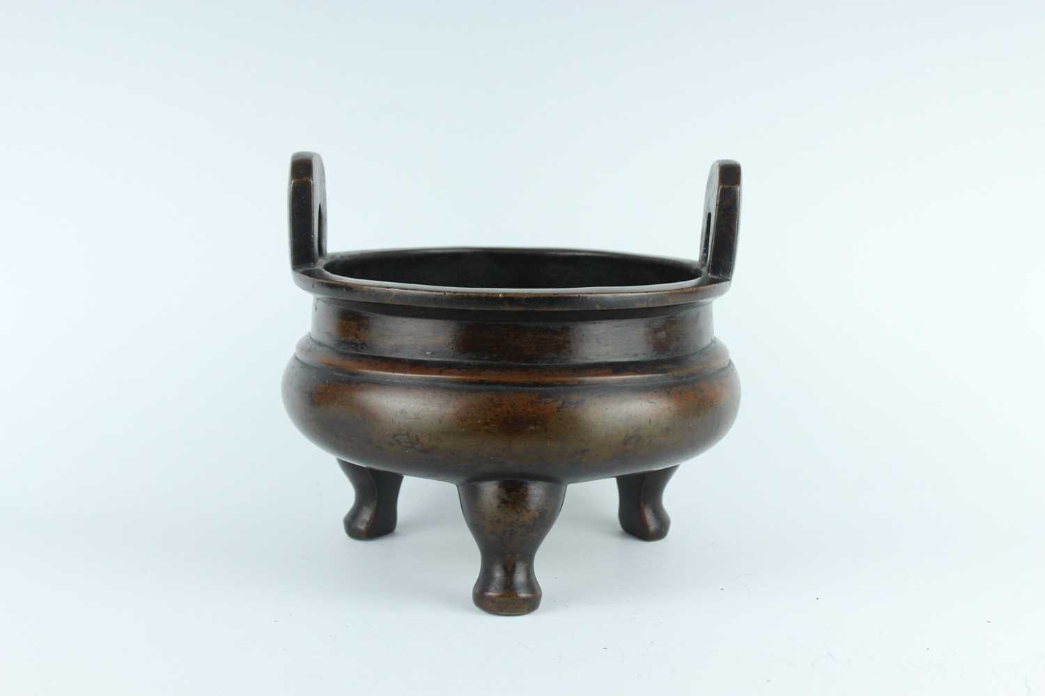 Lot 71 - A large Chinese bronze censer with two handles,...